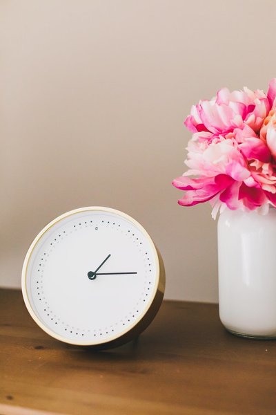 clock-and-flowers-on-side-table.jpg