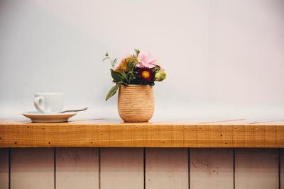 cafe-window-with-cup-and-flowers_373x_2x.progressive.jpg