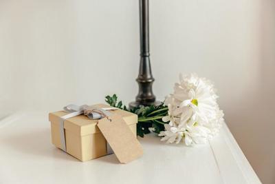 gift-with-flowers-on-bedside-table_373x_2x.progressive.jpg