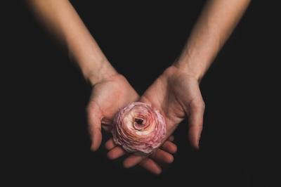 woman-holding-flower_373x_2x.jpg